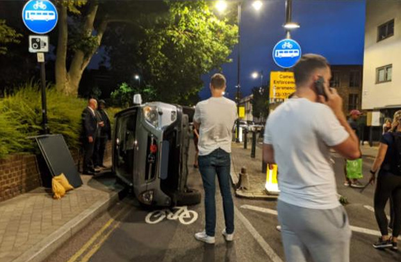 Vehicle flips onto the pavement---what should we do?